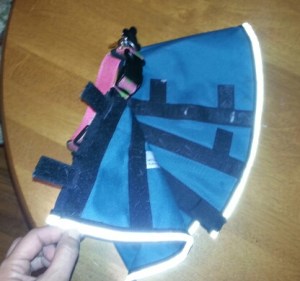 Fold over and align the the Velcro strips so the opening is the same size as the collar